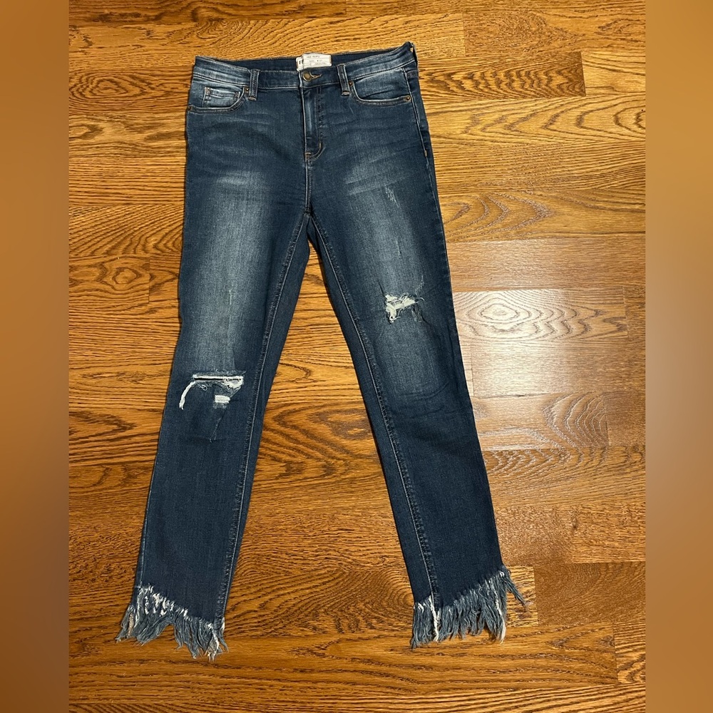 Free People dark skinny mid rise jeans with fringe bottom